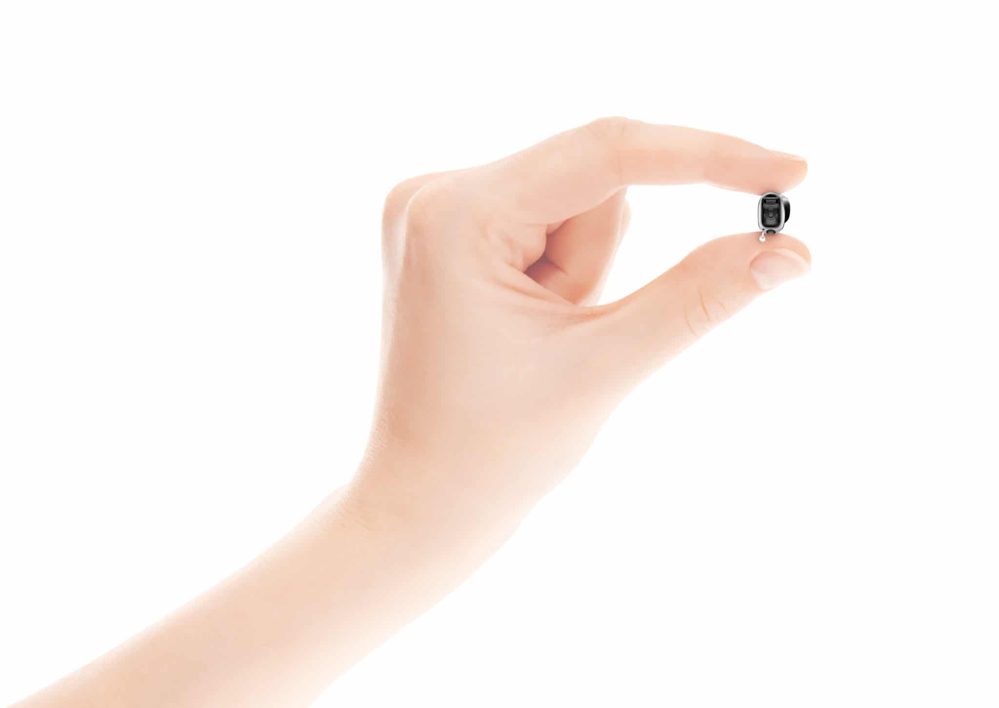 Hand holding hearing aid | San Francisco Audiology