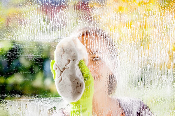 Woman Cleaning Her Hearing Aids in San Francisco 