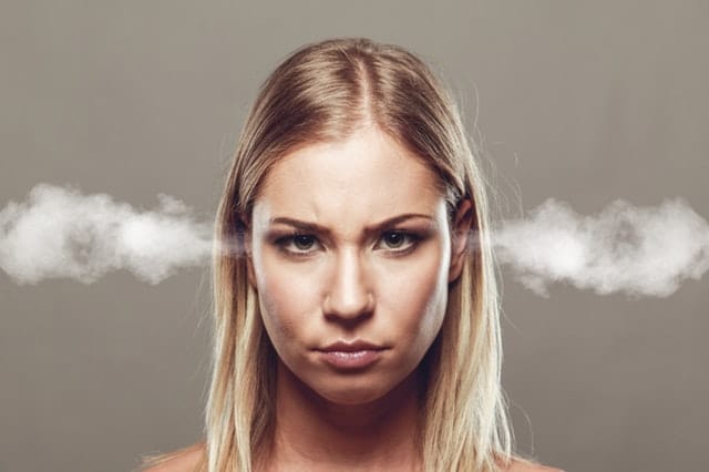 Woman with steam coming out of her ears 