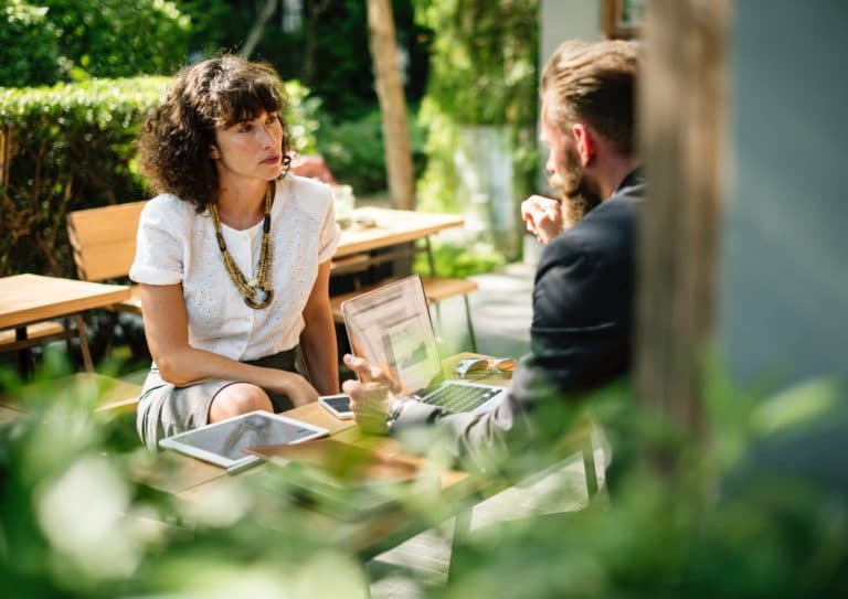 Man and woman having conversation outside