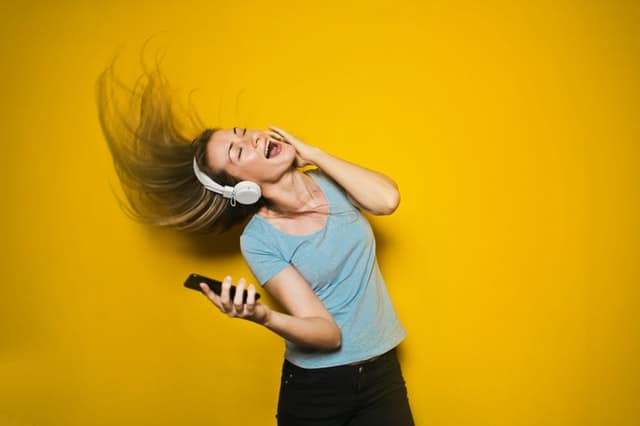 woman listening to headphones