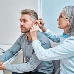 Man is fitted with hearing aids