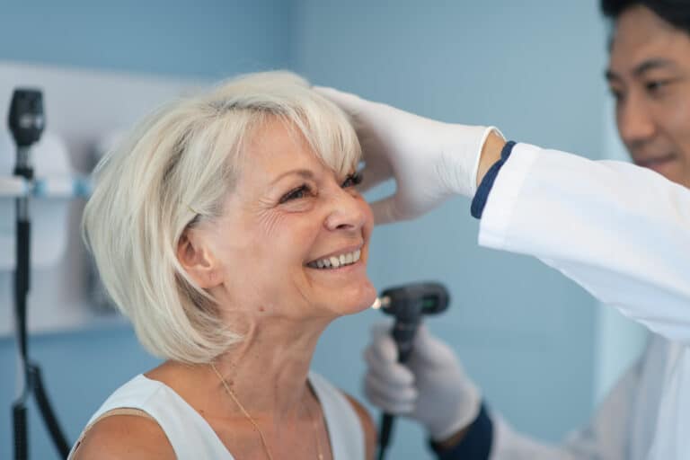 Woman in an ear exam