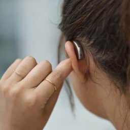 Woman wearing a new hearing aid