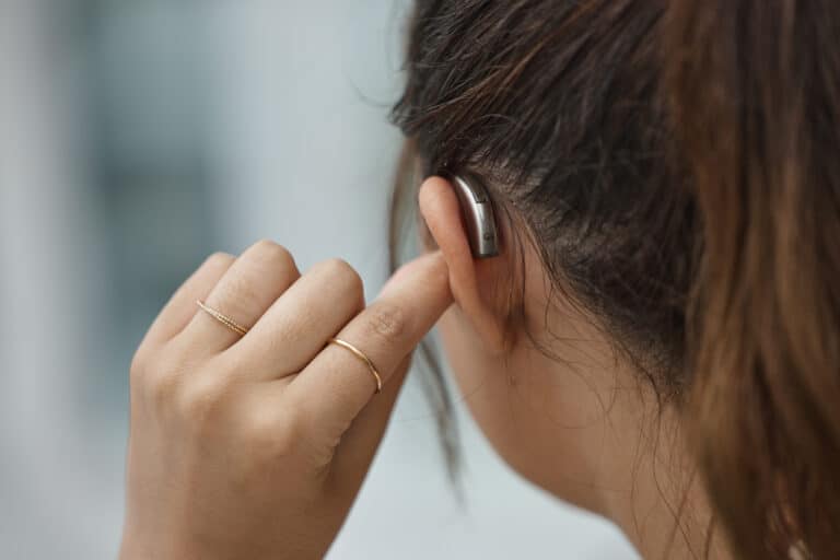 Woman wearing a new hearing aid